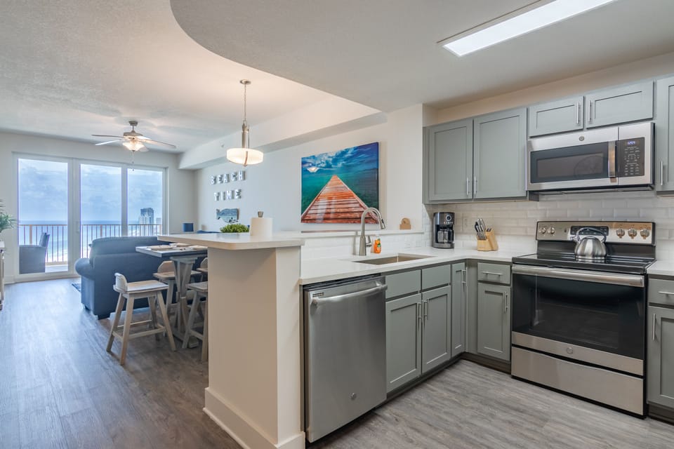 The well-appointed kitchen features full-overlay, hardwood cabinets.
