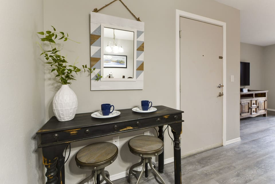 Side table and main door of the condo