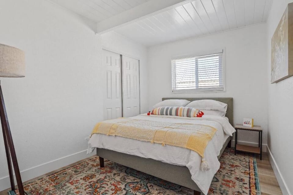 Guest bedroom #1 with a queen-sized bed.