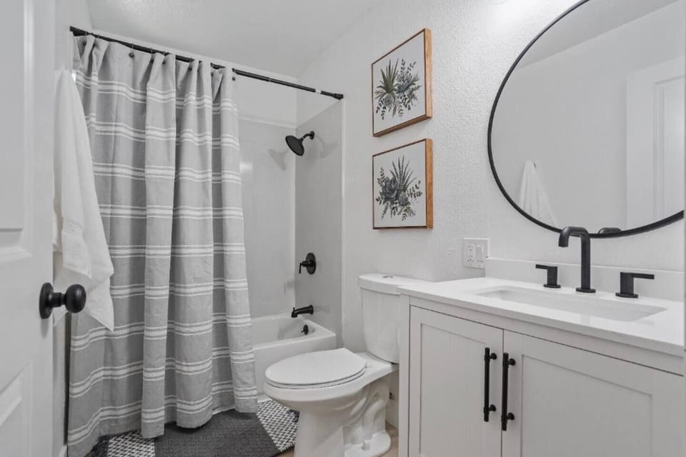 Bathroom with a shower and bathtub.