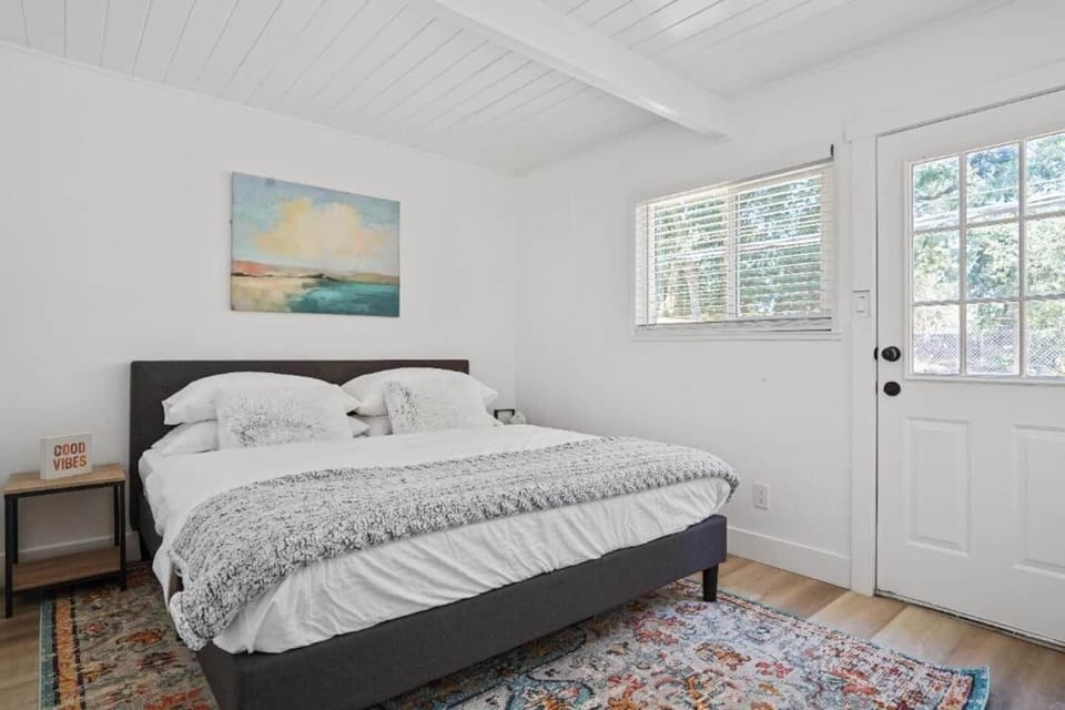 Master bedroom with a king-sized bed.