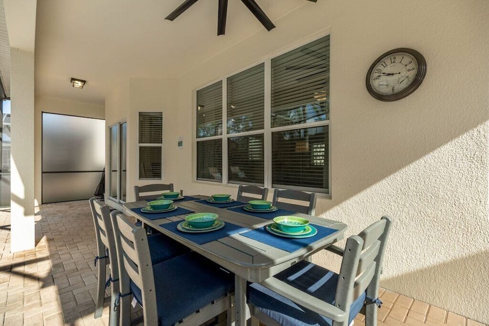 Outdoor dining table complete with outdoor dishware.