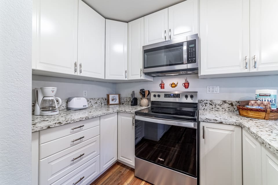 Kitchen comes fully stocked for all cooking needs.