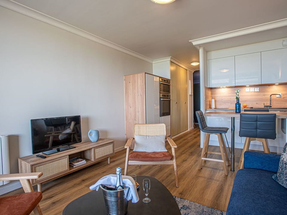 Furniture, Property, Building, Comfort, Wood, Interior Design, Table, Television, Floor, Flooring