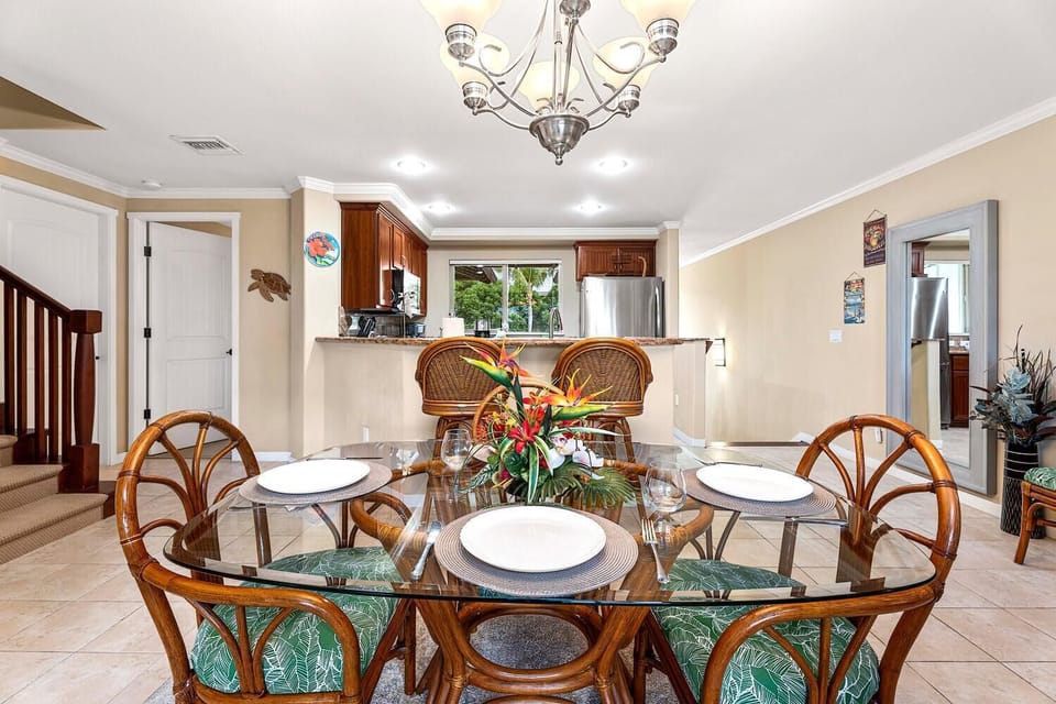 Dining Table with Settings and Woven Seats at Mauna Lani Hawai'i Vacation Rentals