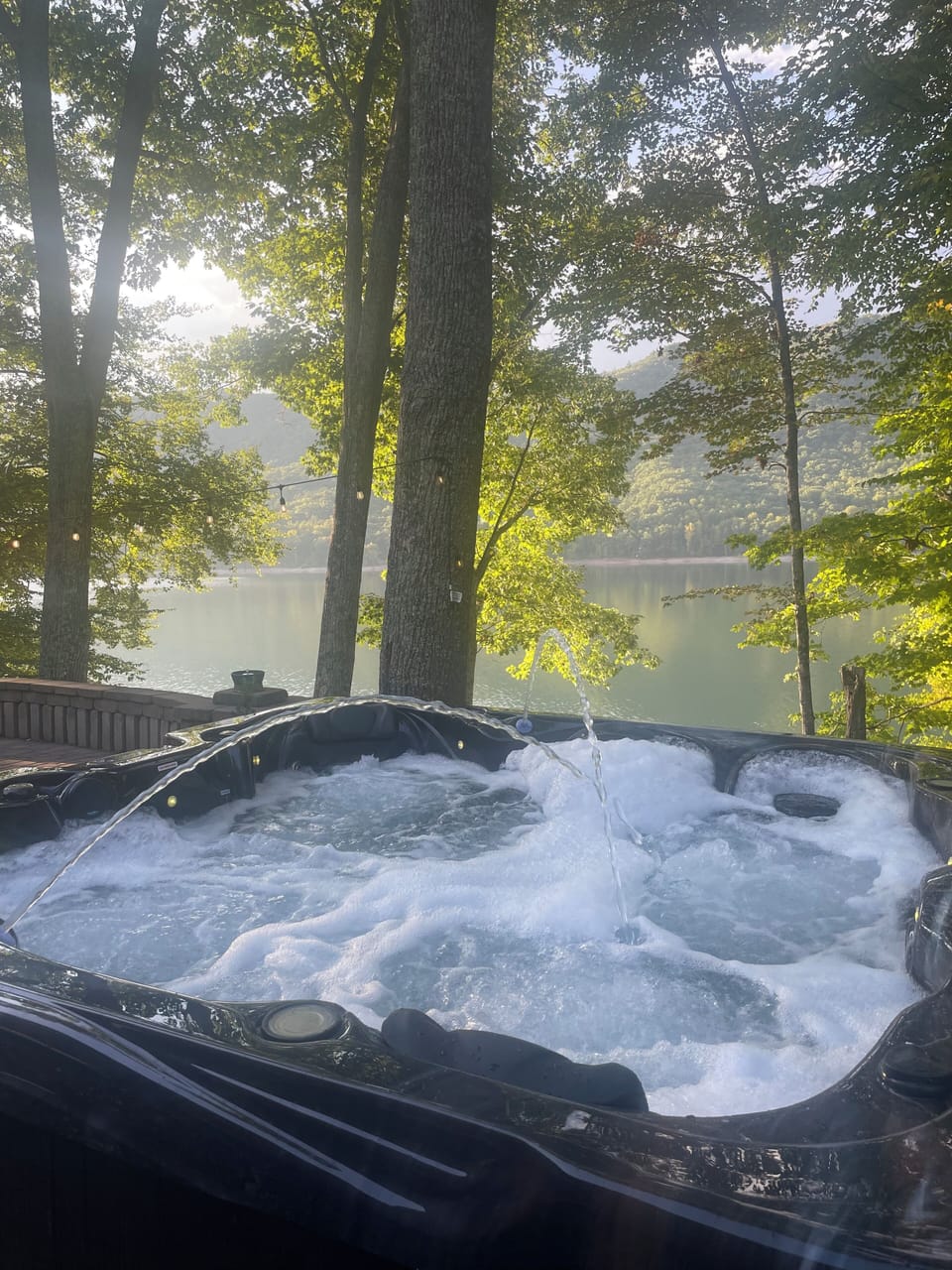 *New* aqua therapy hot tub with Bluetooth, led lights, and a lounger seat.