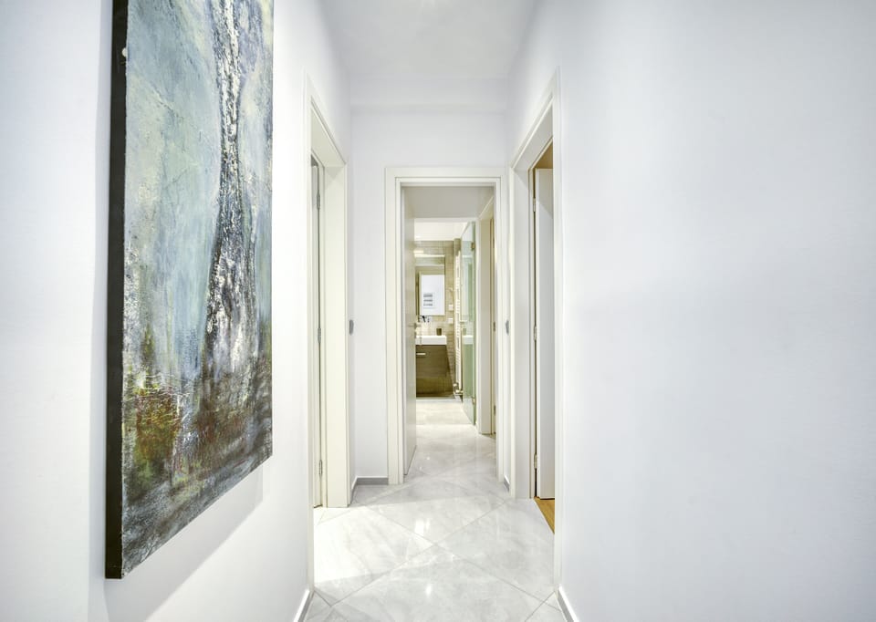 Hallway to all three bedrooms and main bathrooms