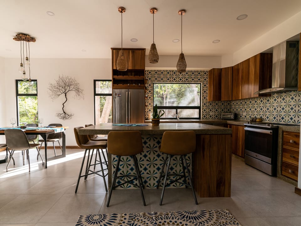 Open layout kitchen, breakfast island with seating for four. 