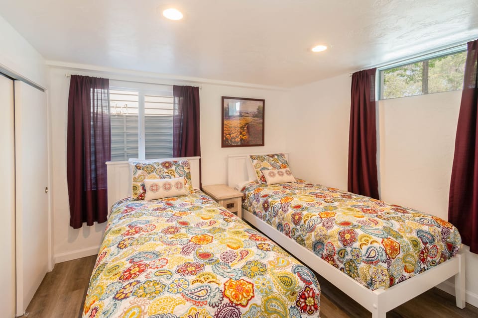 Bedroom 5 in basement with 2 twin XL beds.