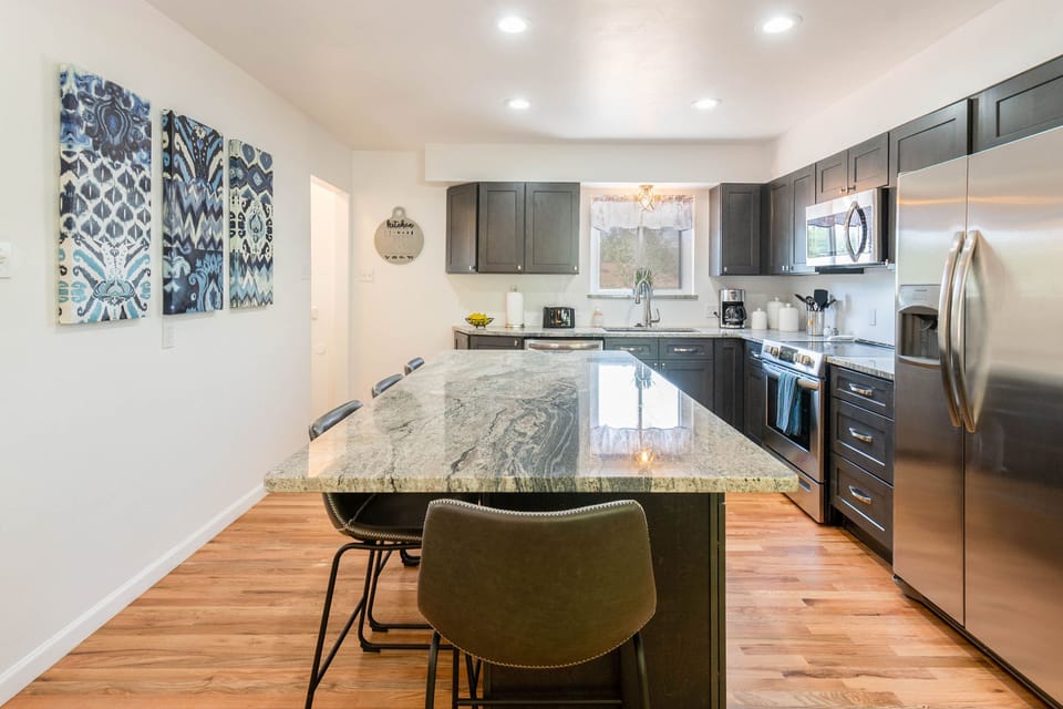 Center Island with Granite Counter-tops and seating for 4.