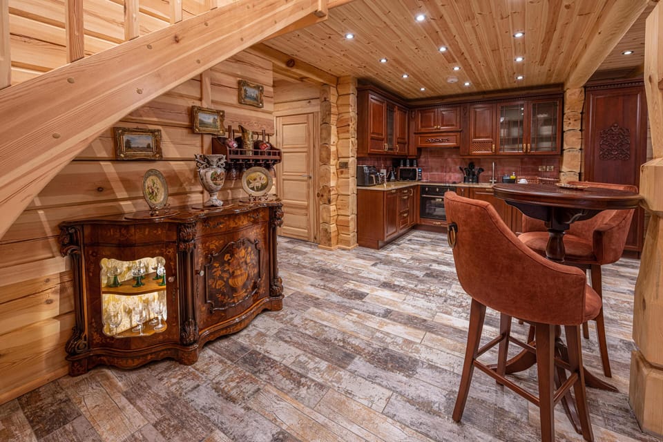 The property boasts a fully equipped kitchen area, a large dining table in the elegant dining room, perfect for enjoying meals together.
