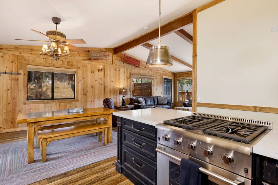 Fully equipped cabin kitchen with ample cabinetry, stove, fridge, microwave, and coffee maker—perfect for cooking meals, morning coffee, and feeling right at home on your stay.