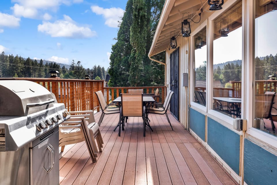 Private outdoor hot tub, surrounded by tall pines, perfect for relaxing under the trees after a day of adventure—enjoy peaceful forest views, fresh air, and a truly rejuvenating stay.