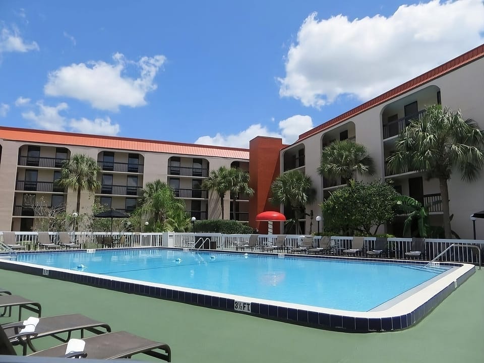 Dive into a sparkling pool with classic resort views.