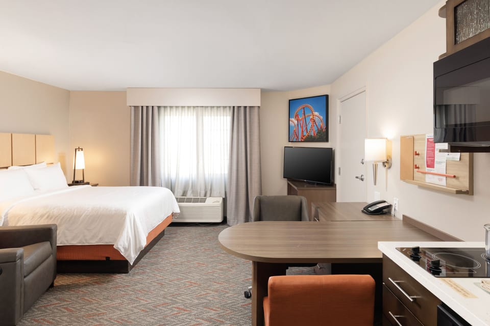 Settle in with a cozy bed and convenient in-room kitchenette.