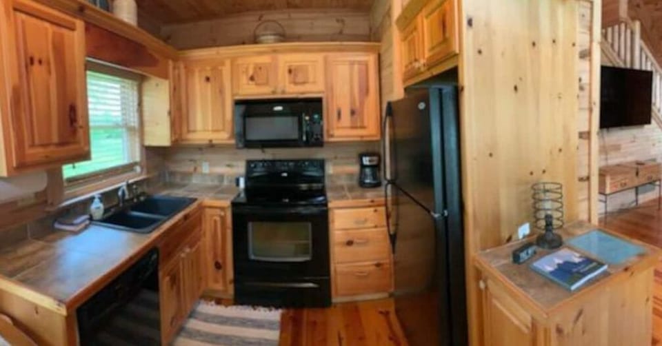 Fully stocked kitchen with single serve and pot coffee maker, blender, crockpot.