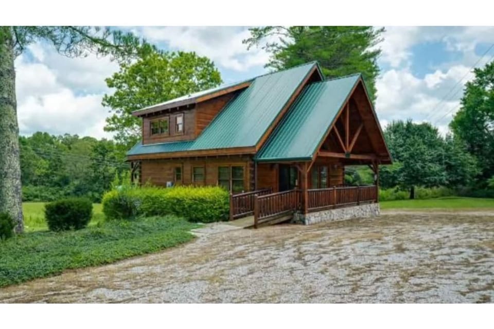 Front of house with large parking area 