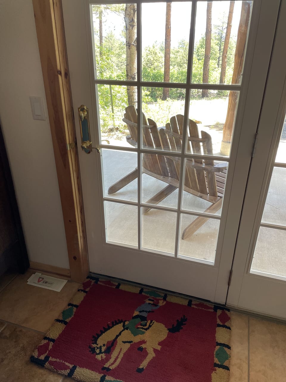 Mountain bedroom french doors to the outside patio.