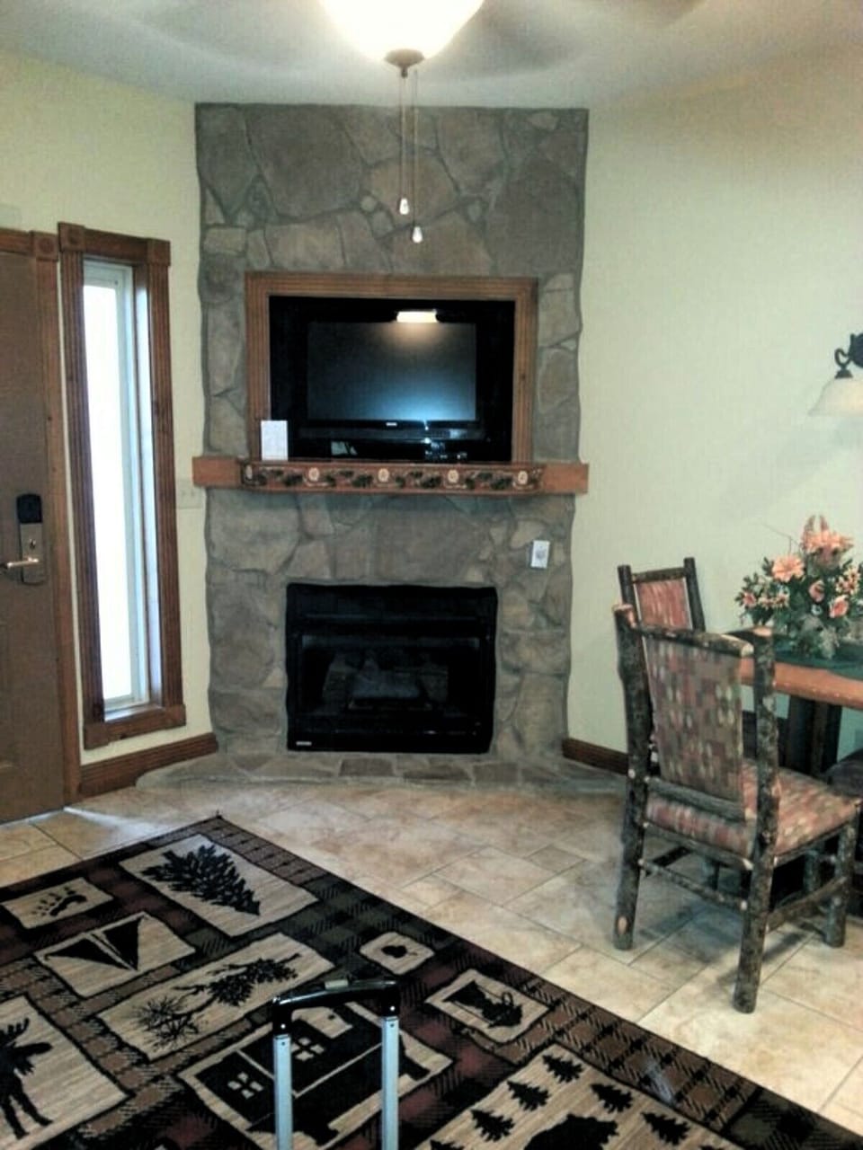 Fireplace and dining area in villa.
