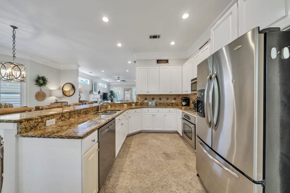 Great open kitchen with plenty of prep & storage space - well-equipped too!