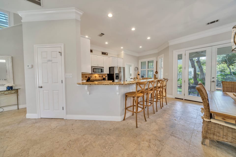 Spacious dining & kitchen features bar seating.