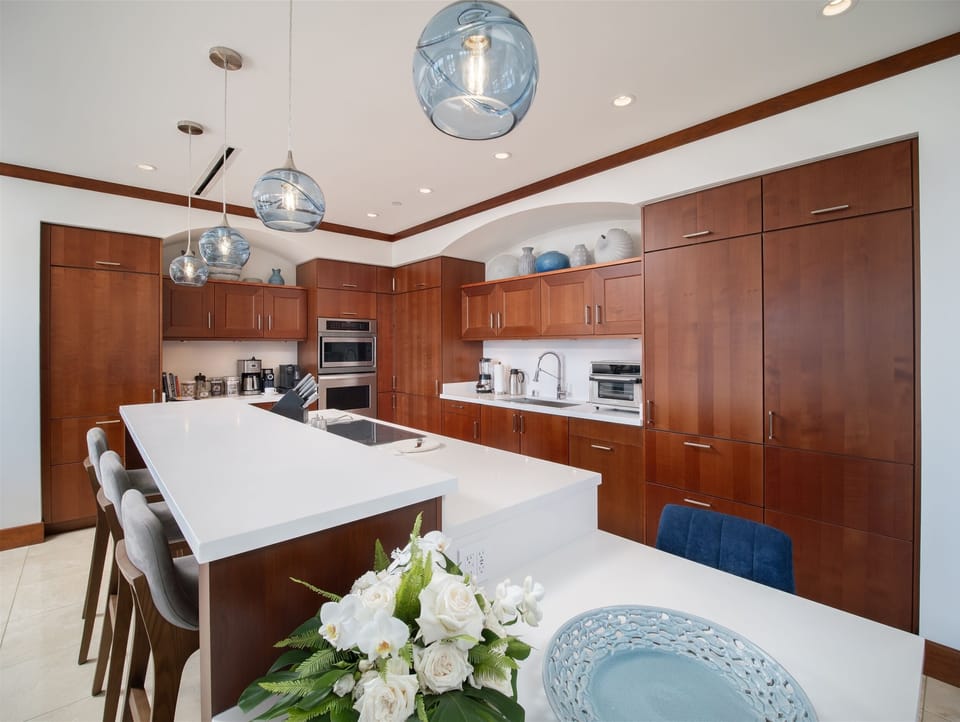 Rich woods and calming blue hues set this gourmet kitchen apart from all others.