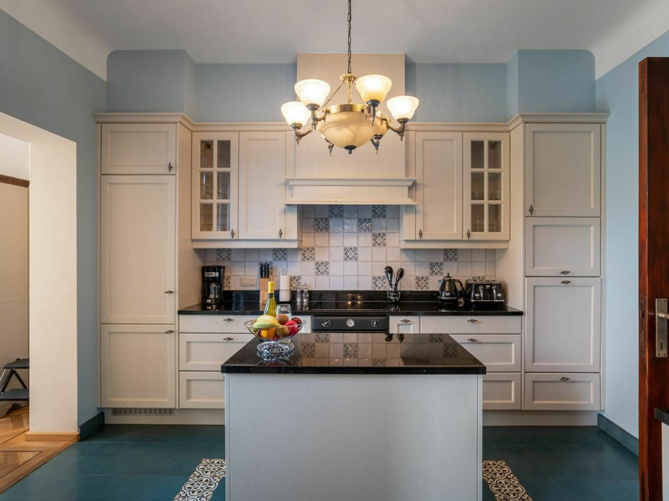 Cabinetry, Countertop, Property, Kitchen Stove, Wood, Kitchen, Sink, Lighting, Home Appliance, Interior Design