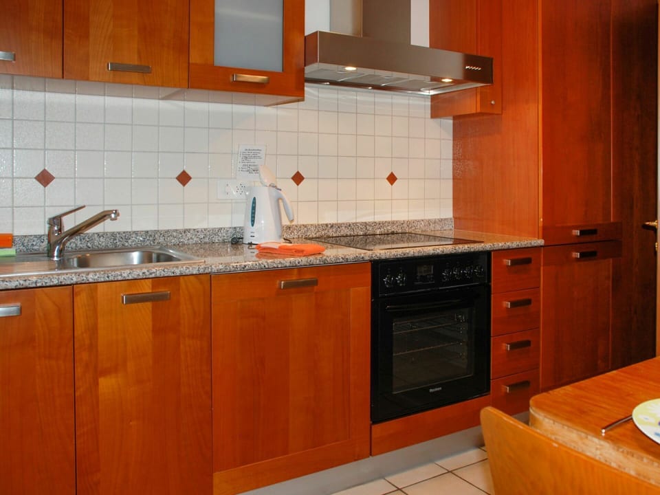 Brown, Cabinetry, Countertop, Kitchen Sink, Sink, Tap, Plumbing Fixture, Kitchen Appliance, Kitchen, Kitchen Stove