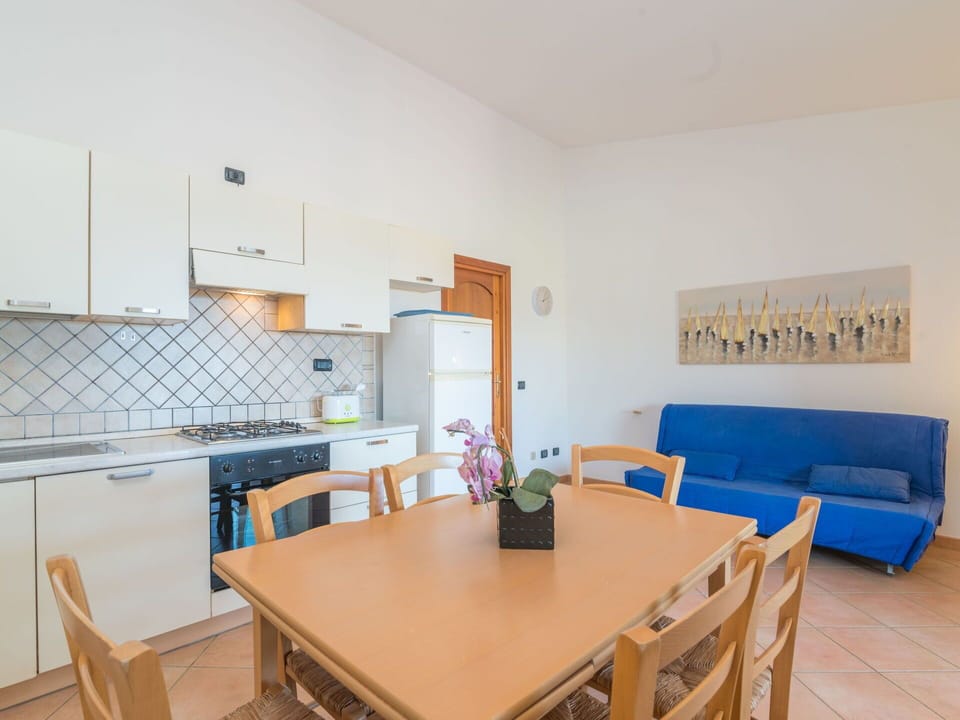 Table, Property, Furniture, Cabinetry, Chair, Wood, Interior Design, Couch, Kitchen Appliance, Kitchen & Dining Room Table