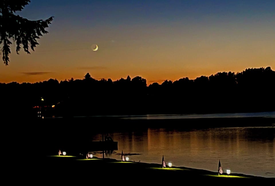 In July, the moon comes to look at the sunset