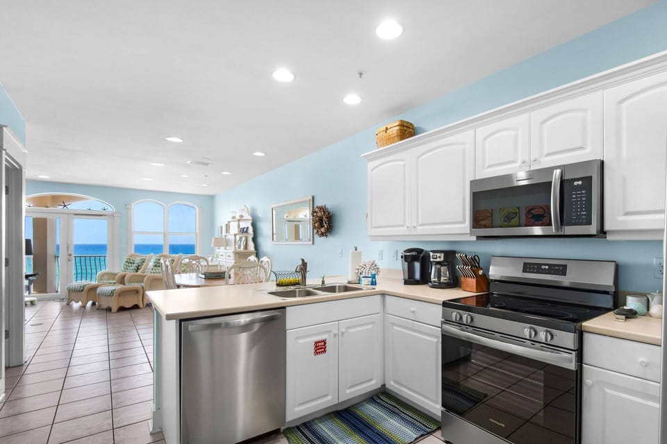 This kitchen with a view boasts brand new appliances for use during your stay!