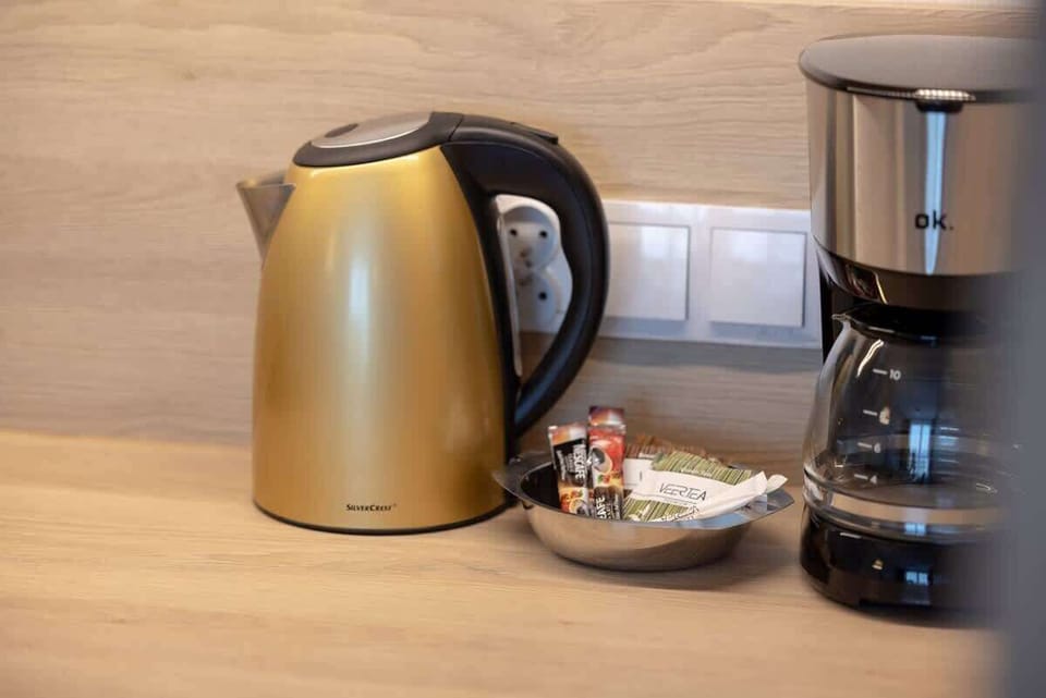 The sleek design of the kitchenette blending seamlessly with the living area.
