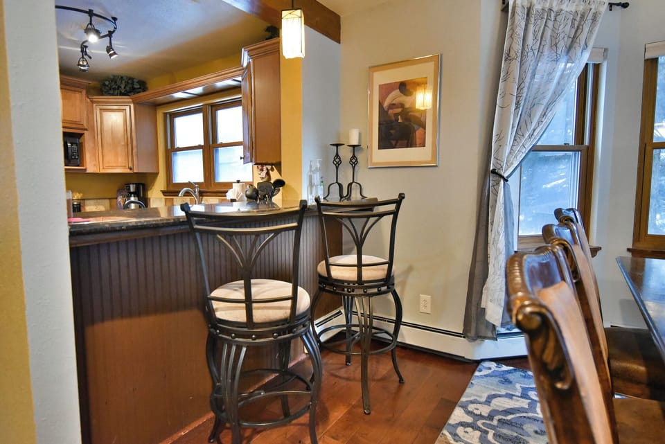 Breakfast Bar - The breakfast bar with seating for two, dividing the kitchen and dining room.