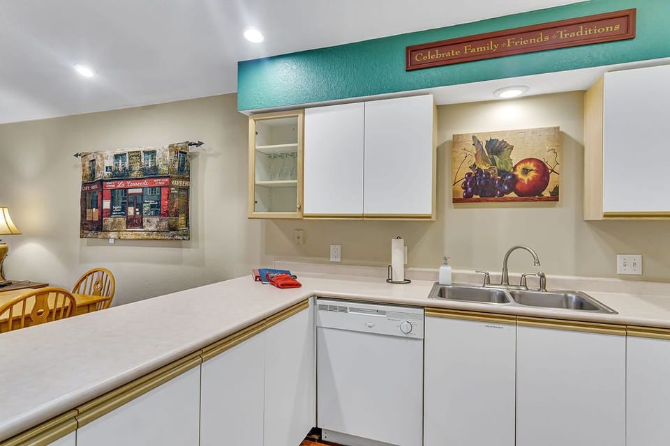 Well-equipped kitchen with lots of cabinets & counter space for preparing meals