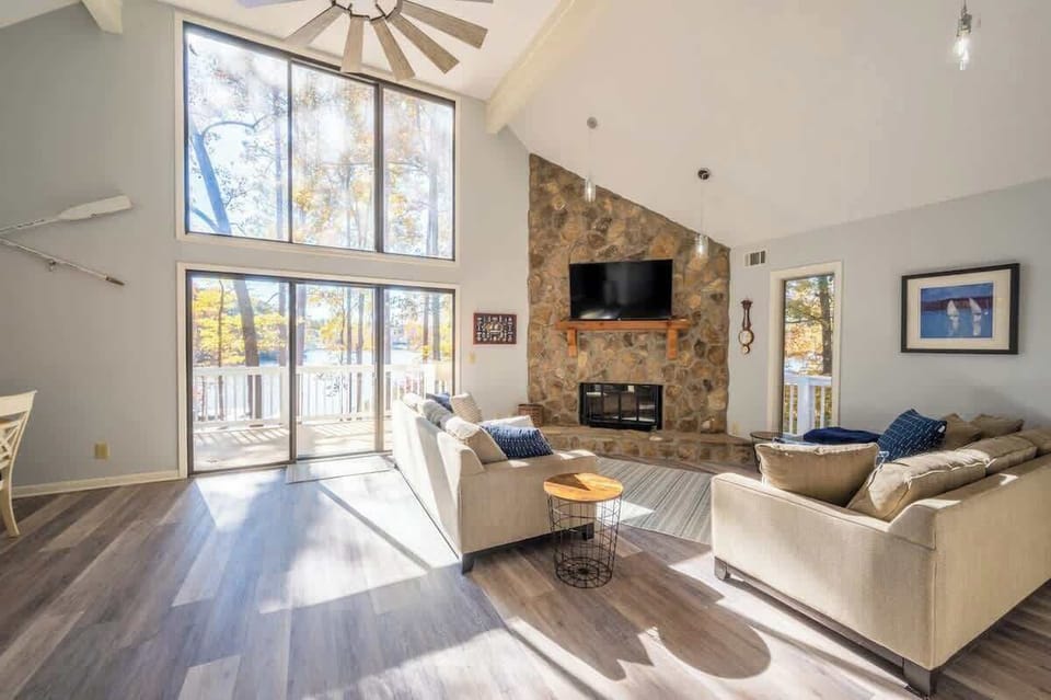 Main Living Area With Stone Fireplace & View Of The Lake