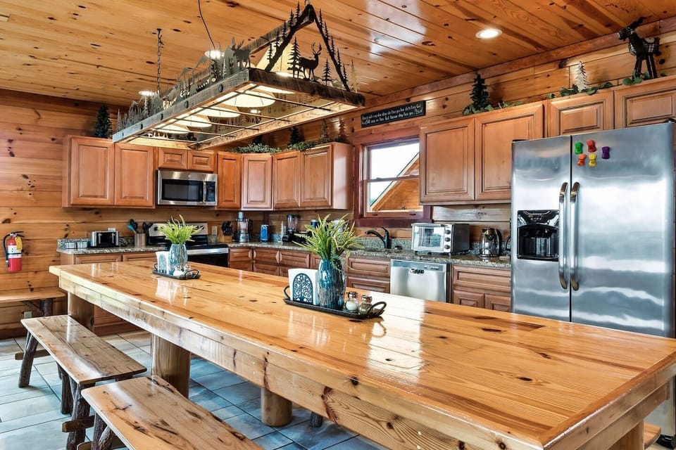 14-Person dining table with custom-made cozy lighting.  Large, home-cooked meals...YES, please!!