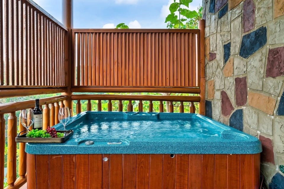 Hot tub with a view and with safety railing located on the lower deck.  Step right in.