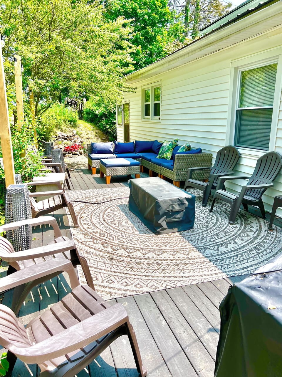 Massive back patio with gas grill and fire pit. 