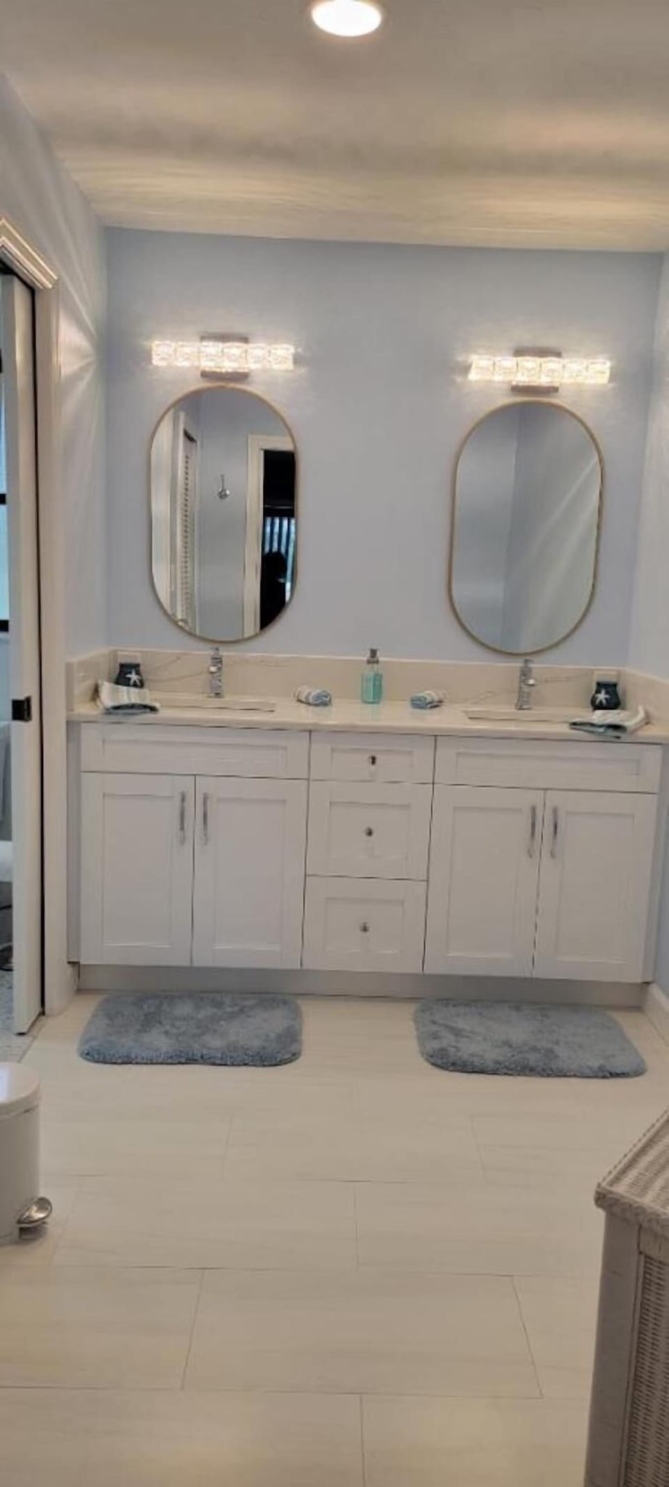 Newly remodeled primary bathroom with separate shower and commode room
