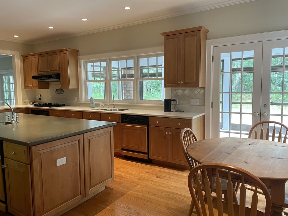 Eat in Kitchen with French doors to screened in porch with dual ceiling fans