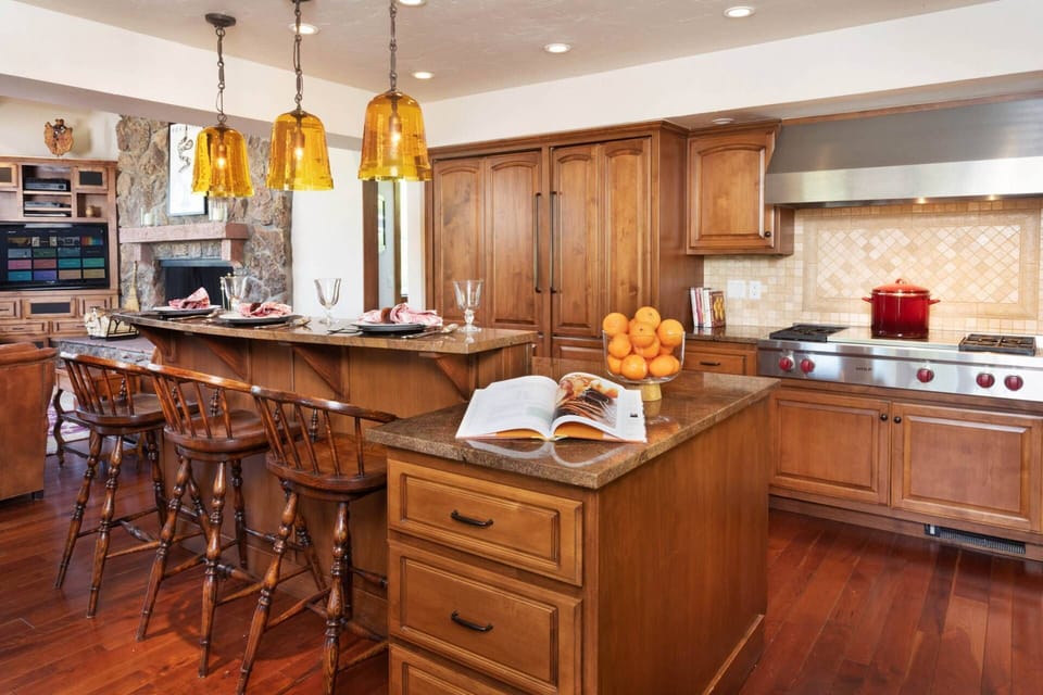 The kitchen is equipped with Wolf stove top and oven, Sub-Zero refrigerators and a wine fridge.