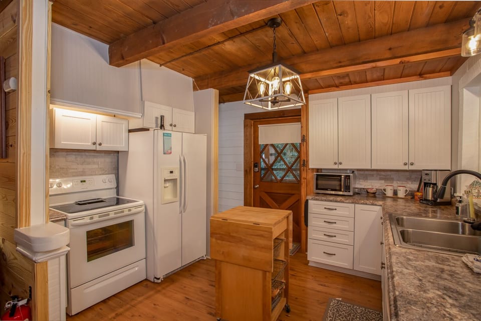 Double Sink and Flat Surface Cooktop in Kitchen