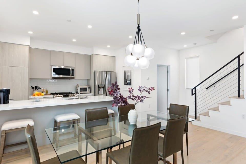 The formal dining space seats 6, with additional 4 counter stools.
