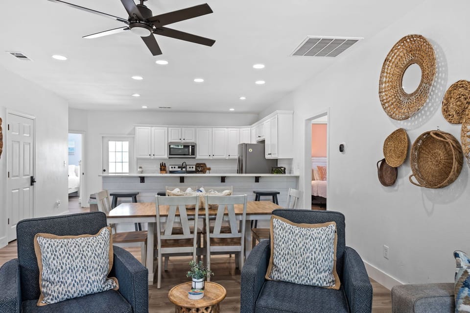 Open floor pThe large center island provides ample space for meal prep and casual dining, while the open floor plan allows for easy entertaining.