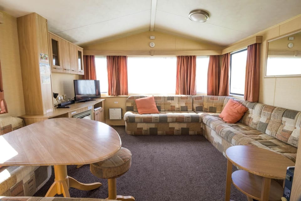 Discover the perfect blend of adventure and relaxation with a static caravan holiday at Naze Marine Holiday Park Essex, offering a cosy living room in a caravan and access to Essex beaches.