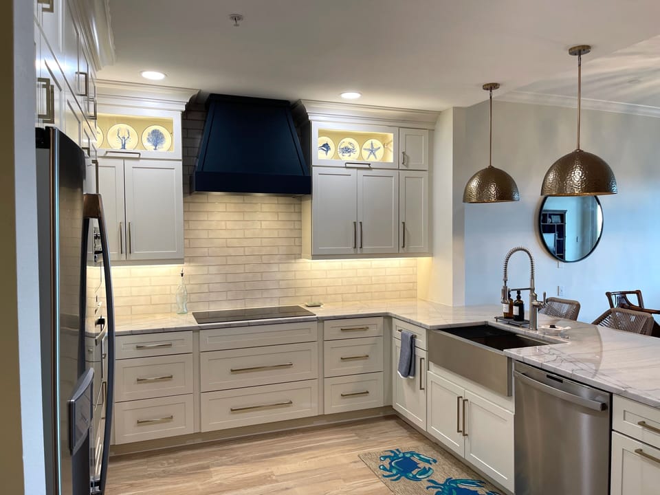 Custom kitchen features all new signature appliances and quartzite countertops.