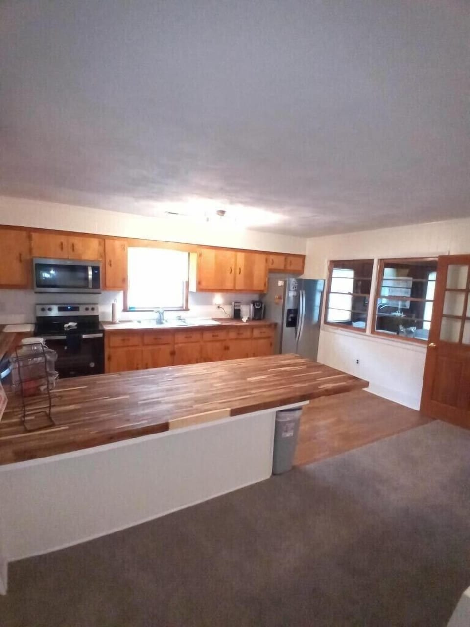 Spacious Kitchen with new appliances and butcher block counters to entertain. 