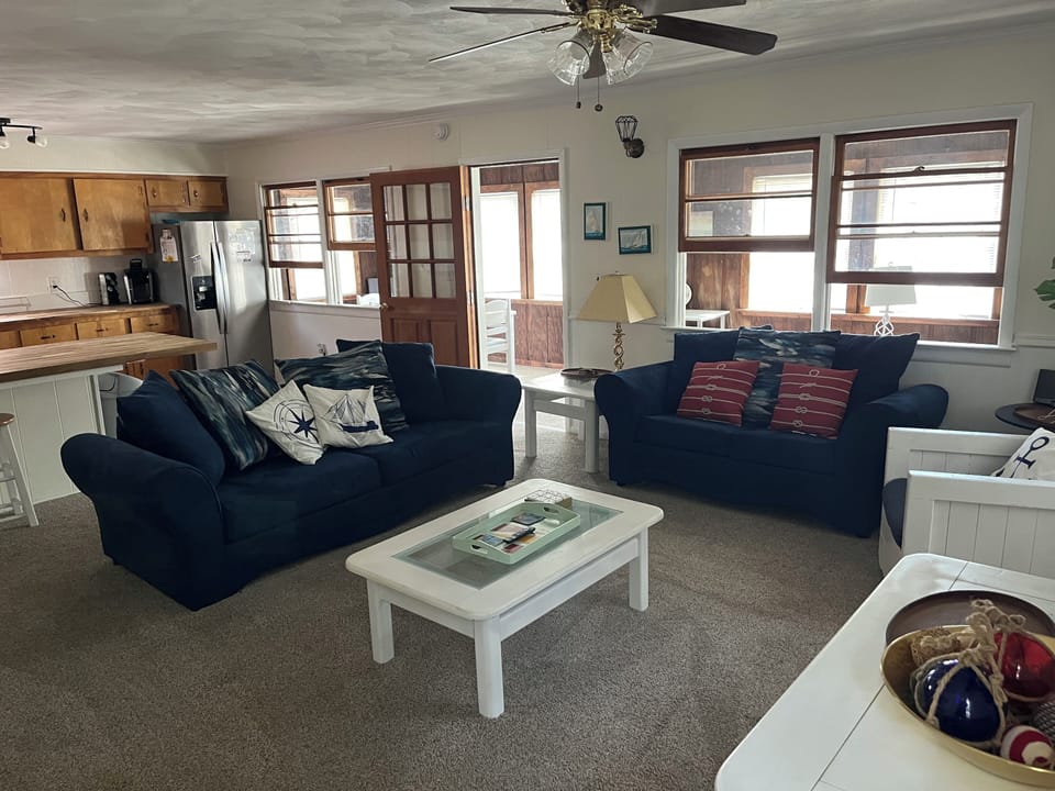 Spacious living room with brand new sofa and love seat. 