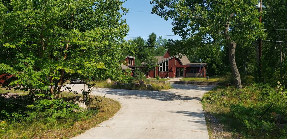 long private driveway leads to the house 