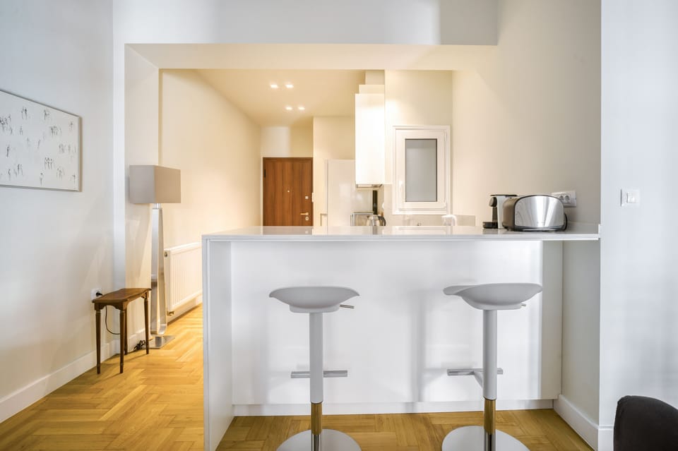 Bar counter by kitchen also acts as alternative home office work space